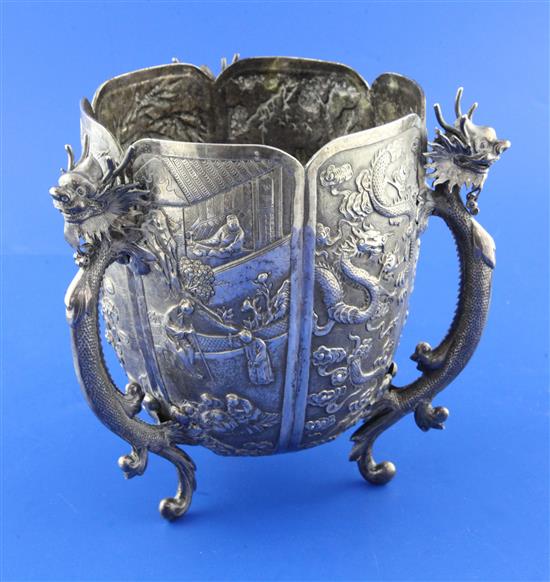 A late 19th/early 20th century Chinese Export silver small jardinere, on three dragon handle supports by Wang Hing, Hong Kong.